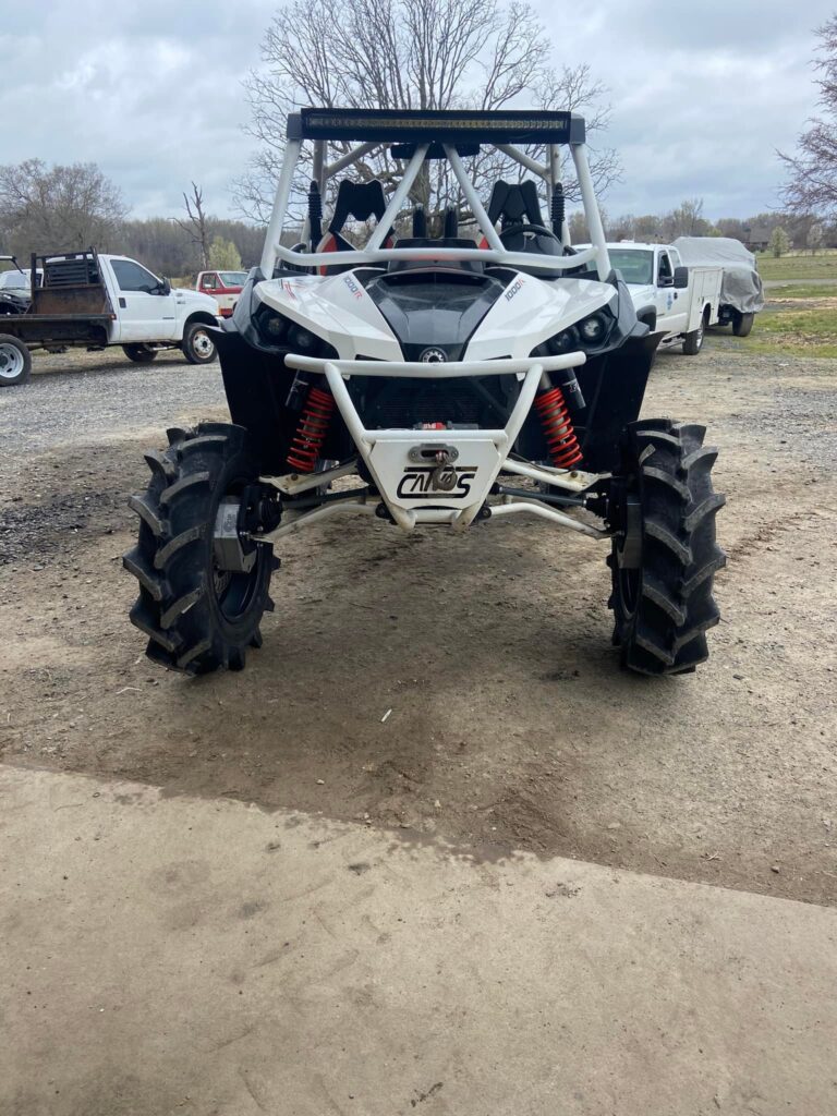 Lifted Can-Am Maverick 1000R side-by-side with mud tires at Say-When Motorsports in Austin, Arkansas