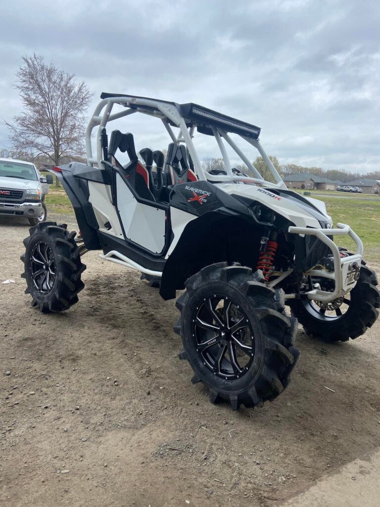 Custom Can-Am Maverick X3 1000R with mud tires, lift kit, and aftermarket wheels at Say When Motorsports in Cabot, Arkansas