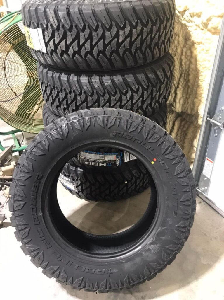 Stack of new RBP Repulsor M/T off-road mud tires inside Say When Motorsports shop