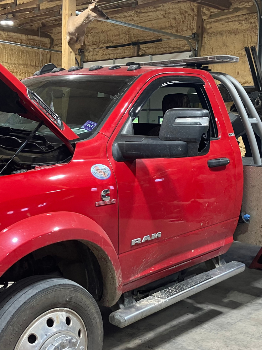 Red Dodge Ram diesel truck in Say When Motorsports Cabot, Arkansas shop undergoing engine and rear axle repair